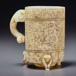 A PALE GREENISH-GREY JADE ARCHAISTIC FOOTED CUP, ZHI