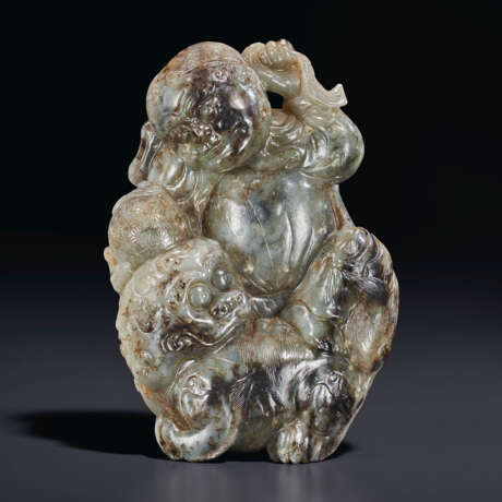 A WELL-CARVED GREYISH-GREEN AND BLACK JADE CARVING OF A FOREIGNER AND MYTHICAL BEAST - photo 1
