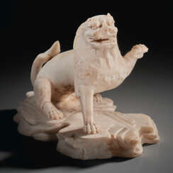 A WHITE MARBLE FIGURE OF A LION