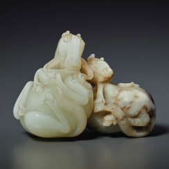 A SPECKLED PALE GREY AND WHITE JADE CARVING OF TWO HORSES