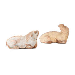 A PAIR OF STUCCO FIGURES OF MYTHICAL BEASTS