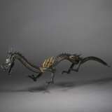 A SILVER ARTICULATED SCULPTURE OF A DRAGON - photo 1