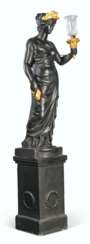 A GILT AND BLACK-PAINTED TORCH-BEARING FIGURE OF CERES