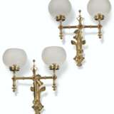 A PAIR OF REFORMED GOTHIC BRASS AND RED-GLASS CABUCHON-SET TWIN LIGHT WALL LIGHTS - photo 1