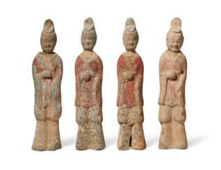 FOUR PAINTED POTTERY FIGURES OF OFFICIALS