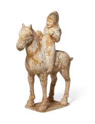 A PAINTED POTTERY FIGURE OF AN EQUESTRIAN 