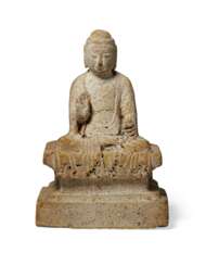 A SMALL STONE FIGURE OF SEATED BUDDHA