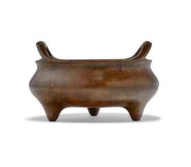 A BRONZE TRIPOD CENSER