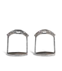 A PAIR OF SILVER DAMASCENED IRON STIRRUPS