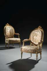 A PAIR OF LOUIS XVI WHITE-PAINTED AND PARCEL-GILT FAUTEUILS COVERED IN SATIN BRODE AUX INDES