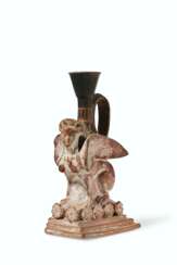 AN ATTIC POTTERY FIGURAL LEKYTHOS IN THE FORM OF A SPHINX