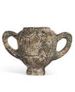 Minoan civilization. A MINOAN SERPENTINE TWO-HANDLED CUP