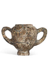 A MINOAN SERPENTINE TWO-HANDLED CUP