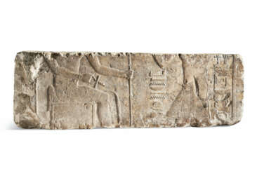 AN EGYPTIAN LIMESTONE RELIEF FRAGMENT