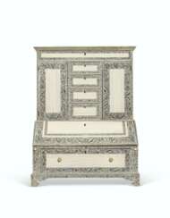 AN ANGLO-INDIAN ETCHED IVORY AND SANDALWOOD TABLE BUREAU-CABINET