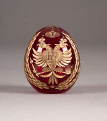 A GLASS EASTER EGG WITH DOUBLE-HEADED EAGLE AND IMPERIAL CYPHER OF NICHOLAS II OF RUSSIA