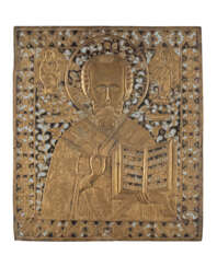 A LARGE AND ENAMEL BRASS ICON SHOWING ST. NICHOLAS OF MYRA