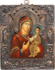 AN ICON SHOWING THE SMOLENSKAYA MOTHER OF GOD WITH SILVER RIZA