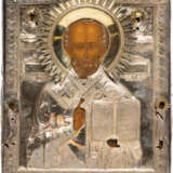 A LARGE ICON SHOWING ST. NICHOLAS OF MYRA WITH A SILVER OKLAD WITHIN KYOT - photo 1