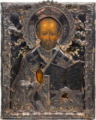 A LARGE ICON SHOWING ST. NICHOLAS OF MYRA WITH A SILVER-GILT OKLAD