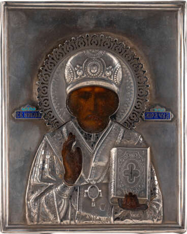 A SMALL ICON SHOWING ST. NICHOLAS OF MYRA WITH A SILVER AND CHAMPLEVÉ ENAMEL OKLAD - photo 1