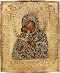 AN ICON SHOWING THE VLADIMIRSKAYA MOTHER OF GOD WITH AN EMBROIDERED SILVER-GILT OKLAD