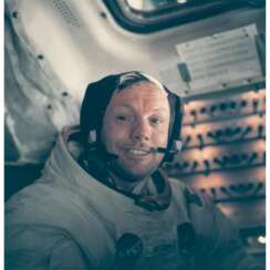 PORTRAIT OF NEIL ARMSTRONG BACK IN THE LUNAR MODULE AFTER THE HISTORIC MOONWALK