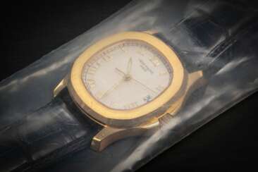 PATEK PHILIPPE, AQUANAUT REF. 5060SJ, A ‘FACTORY-SEALED’ YELLOW GOLD WRISTWATCH