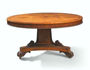 A GEORGE IV AMBOYNA AND GONCALO ALVES-BANDED CENTRE TABLE