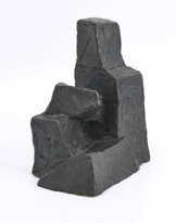 Kleine sitzende Figur