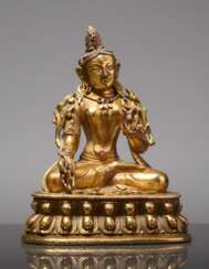 EARLY SMALL BRONZE FIGURE OF WHITE TARA WITH A MAGNIFICENT GOLD PLATING AND RUBIES