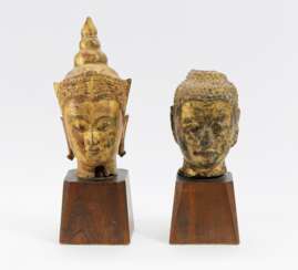 Zwei Buddhaköpfe