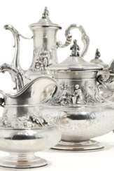 Four piece silver service with varying scenic decor