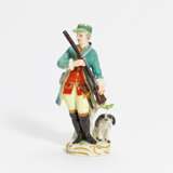 Porcelain figurine of hunter with musket and dog - фото 1