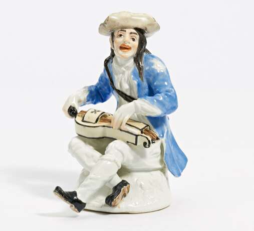 Porcelain figurine of beggar with hurdy gurdy - photo 1