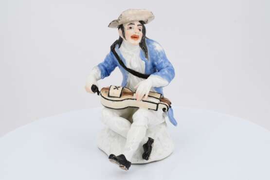 Porcelain figurine of beggar with hurdy gurdy - фото 2