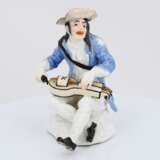 Porcelain figurine of beggar with hurdy gurdy - photo 2