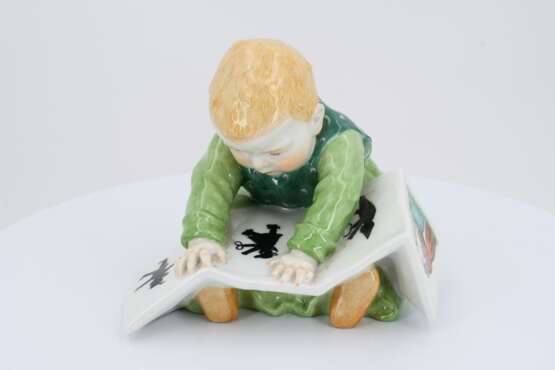 Porcelain figurine of child with storybook - photo 2