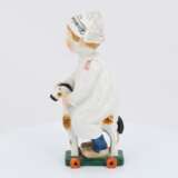 Porcelain figurine of boy riding a wooden horse - photo 3