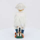 Porcelain figurine of boy riding a wooden horse - photo 4