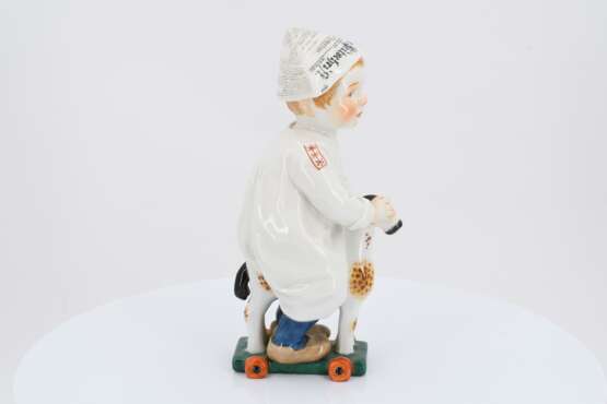 Porcelain figurine of boy riding a wooden horse - photo 5