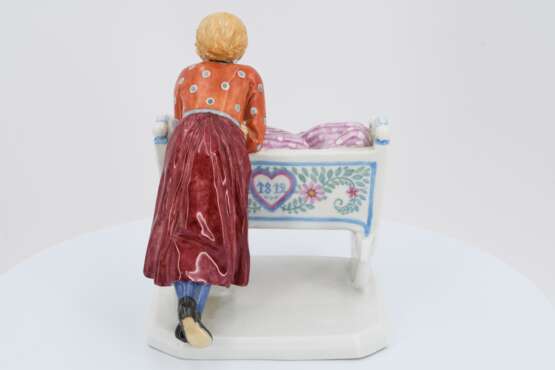Porcelain figurine of girl with cradle - photo 4