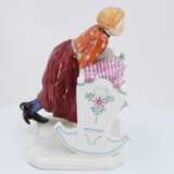 Porcelain figurine of girl with cradle - photo 5