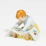Porcelain figurine of child with picture-book - фото 1