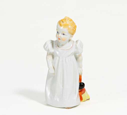Porcelain figurine of girl with doll - photo 1