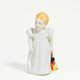 Porcelain figurine of girl with doll - photo 1