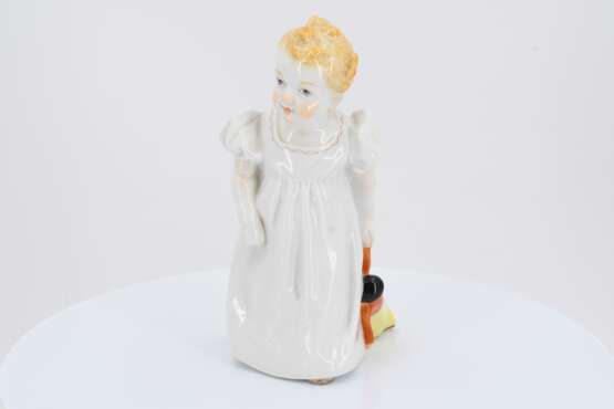 Porcelain figurine of girl with doll - photo 2