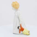 Porcelain figurine of girl with doll - photo 3