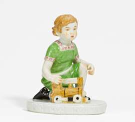 Porcelain figurine of boy with locomotive