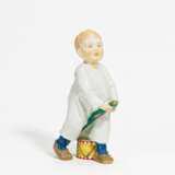 Porcelain figurine of boy with drumstick and drum - photo 1